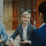 Business professionals discussing documents in an office
