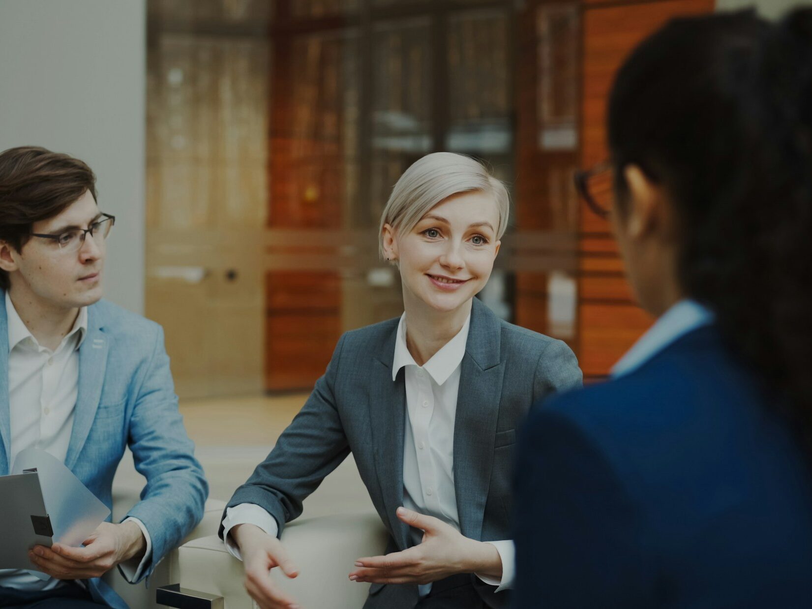 Business professionals discussing documents in an office