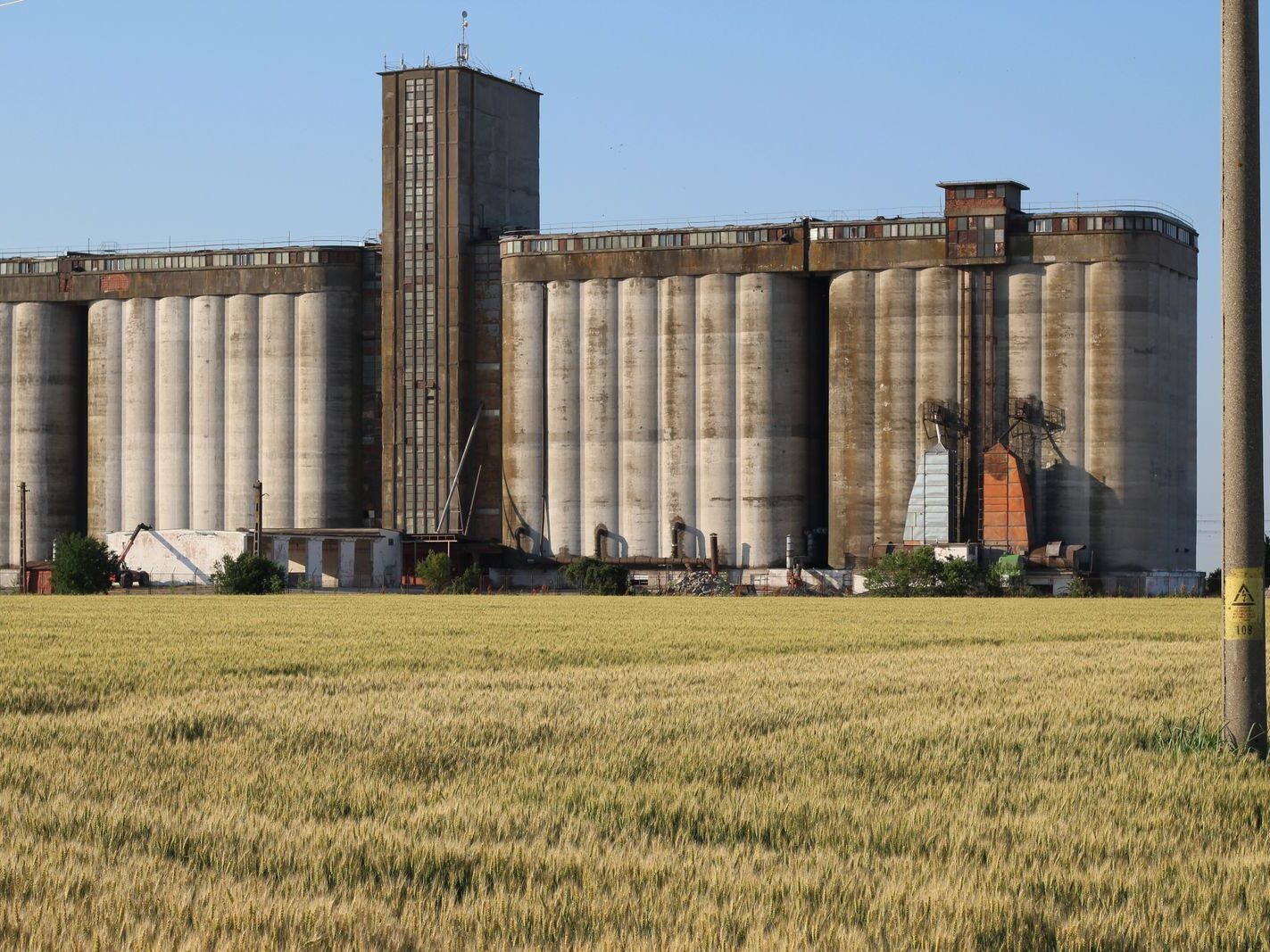 Agricultural field and grain silos