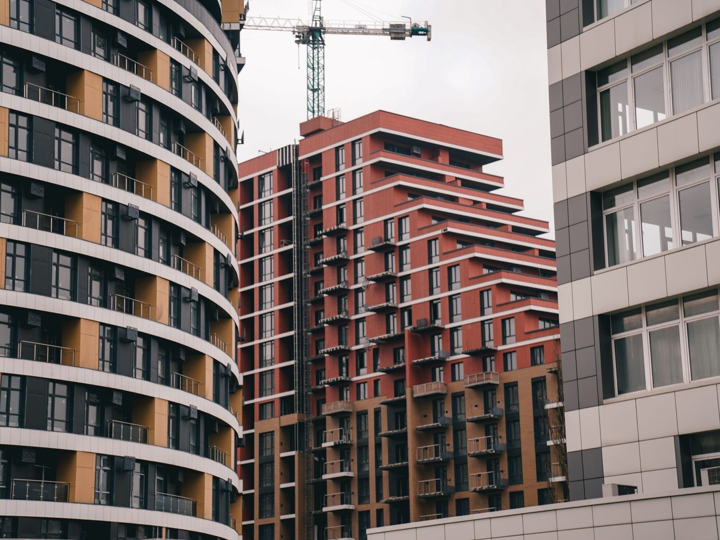 Modern buildings and construction crane in Kyiv, Ukraine