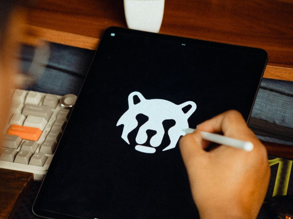 Designer drawing a logo on a tablet