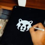 Designer drawing a logo on a tablet