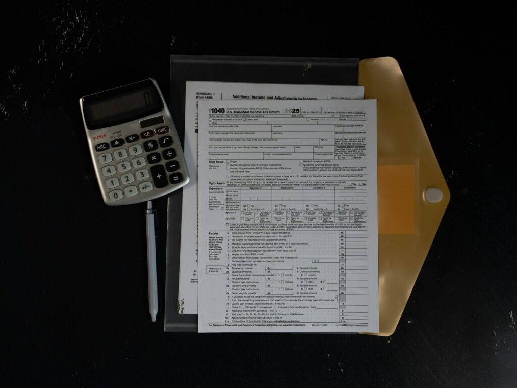 Calculator and financial documents on a desk