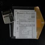 Calculator and financial documents on a desk